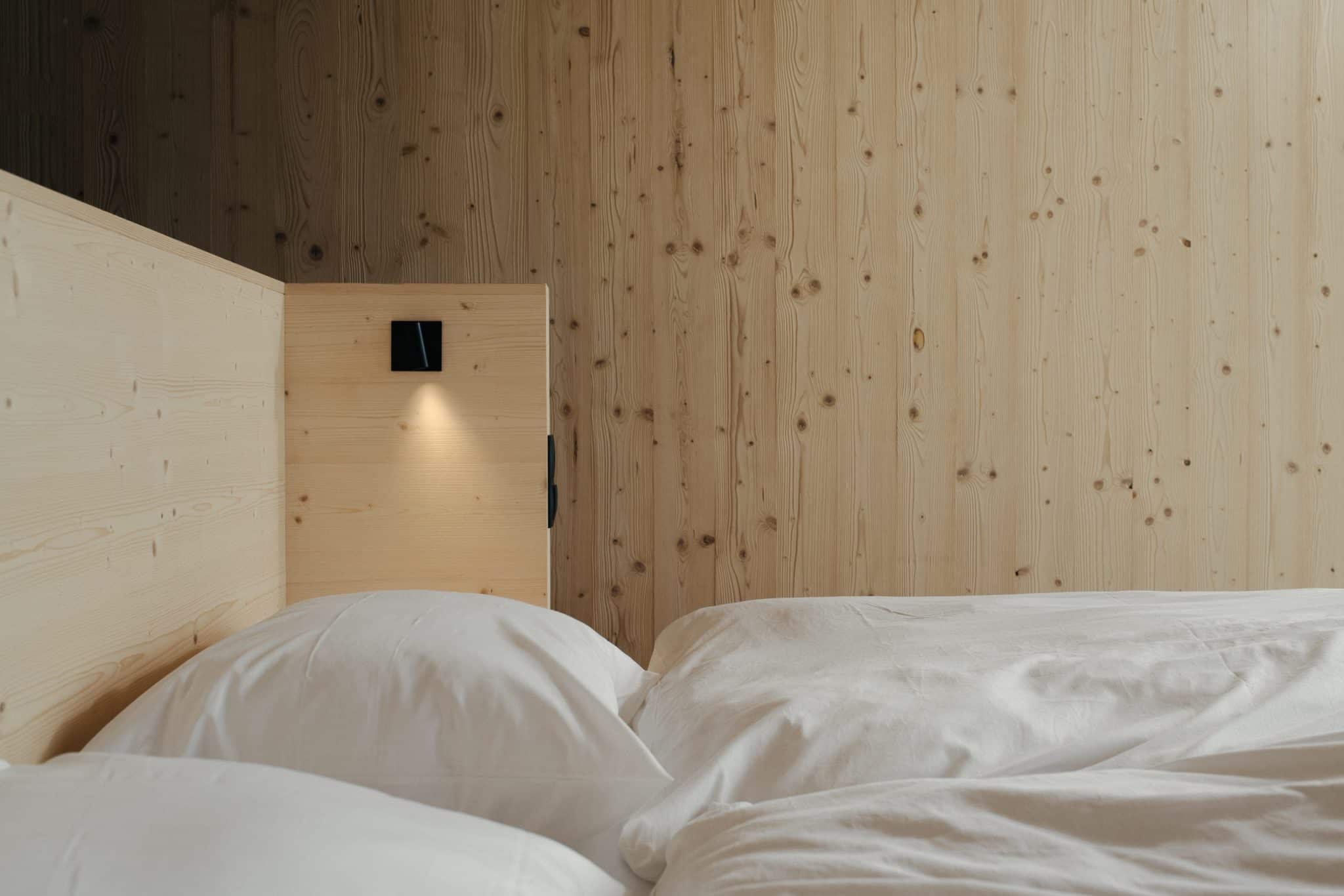 different mountain suites, bed made of light pine wood