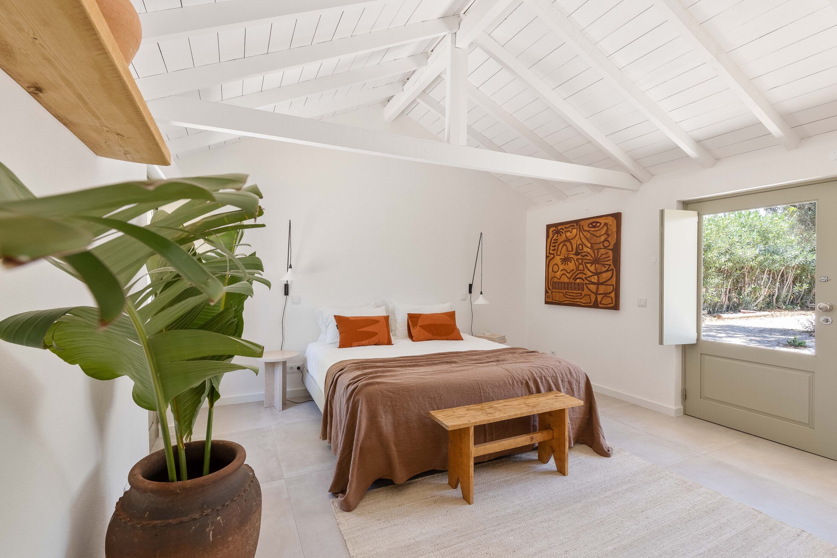 Schlafzimmer mit Bananenstaude im Ferienhaus âmago