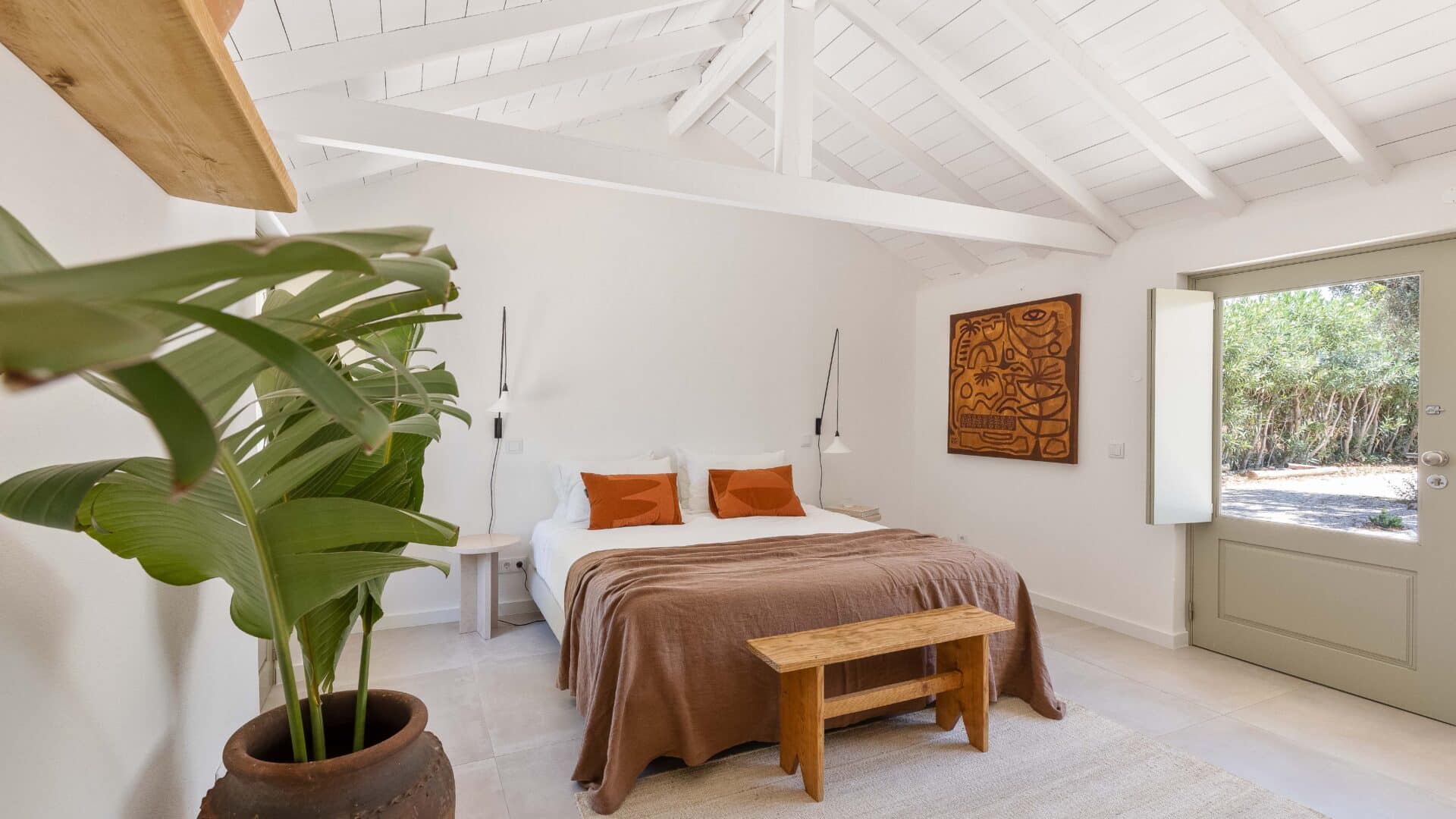 Schlafzimmer mit Bananenstaude im Ferienhaus âmago