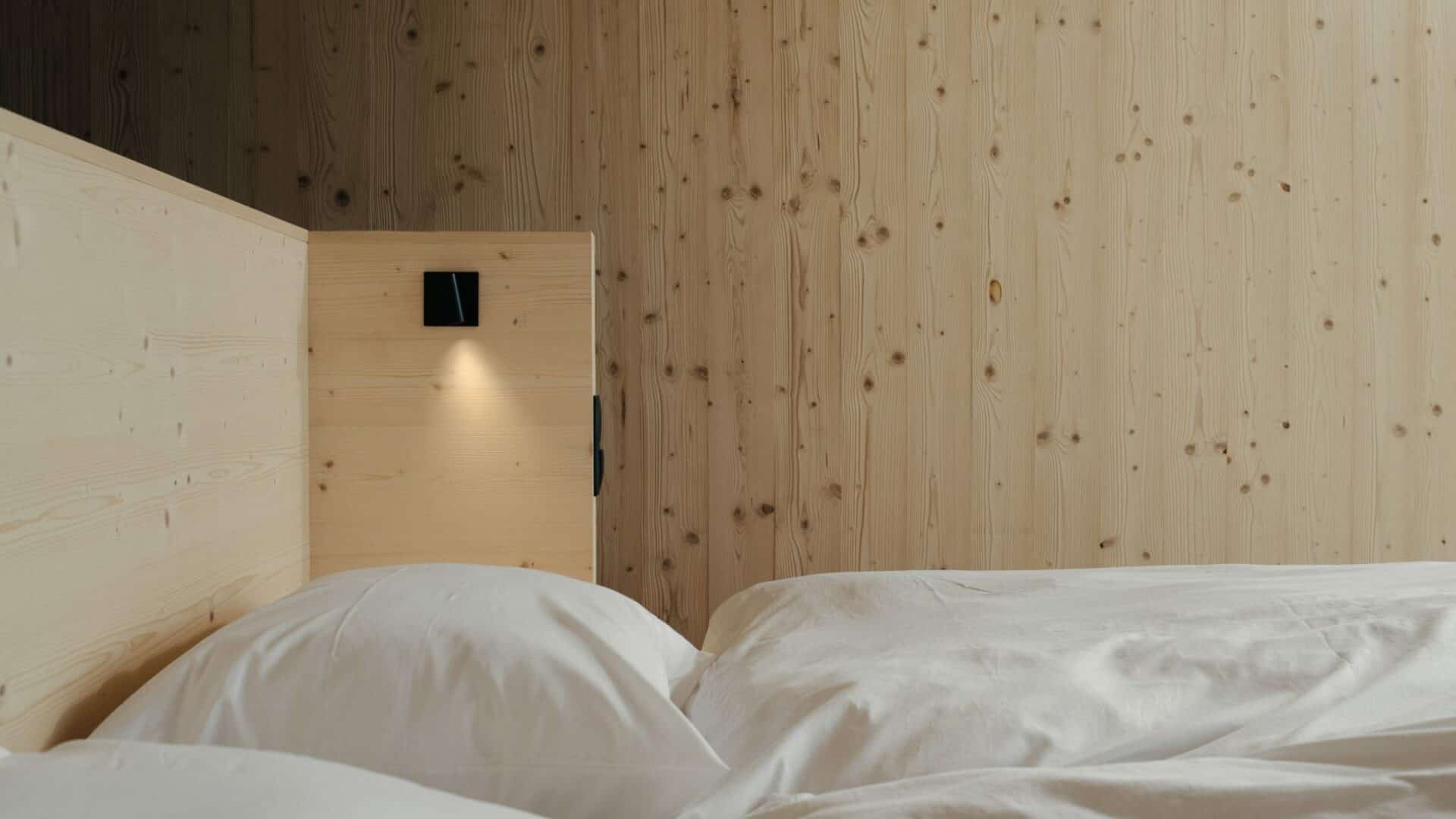 different mountain suites, bed made of light pine wood